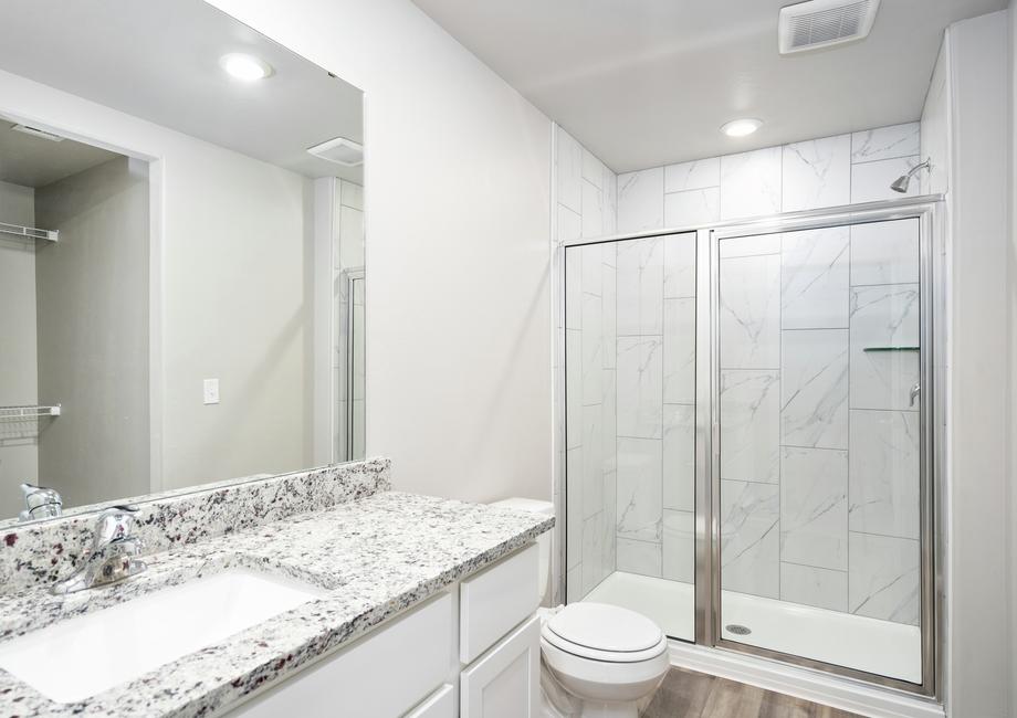 The master bathroom has a wonderful glass, walk-in shower.