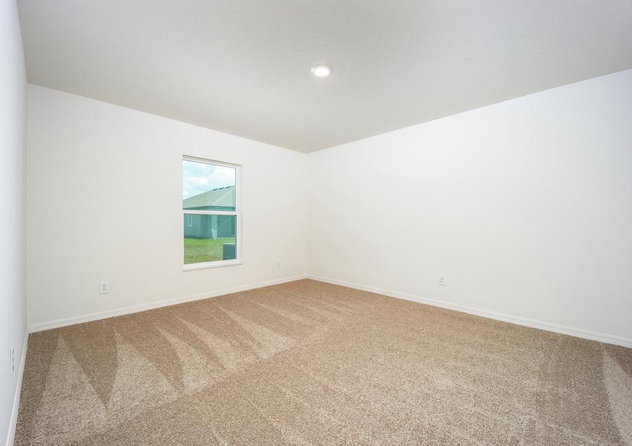 Large master bedroom with carpet
