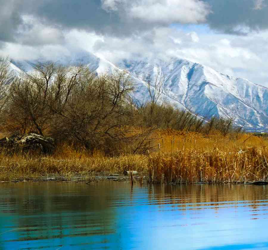 A glimpse of Utah Lake with mountains in the background.