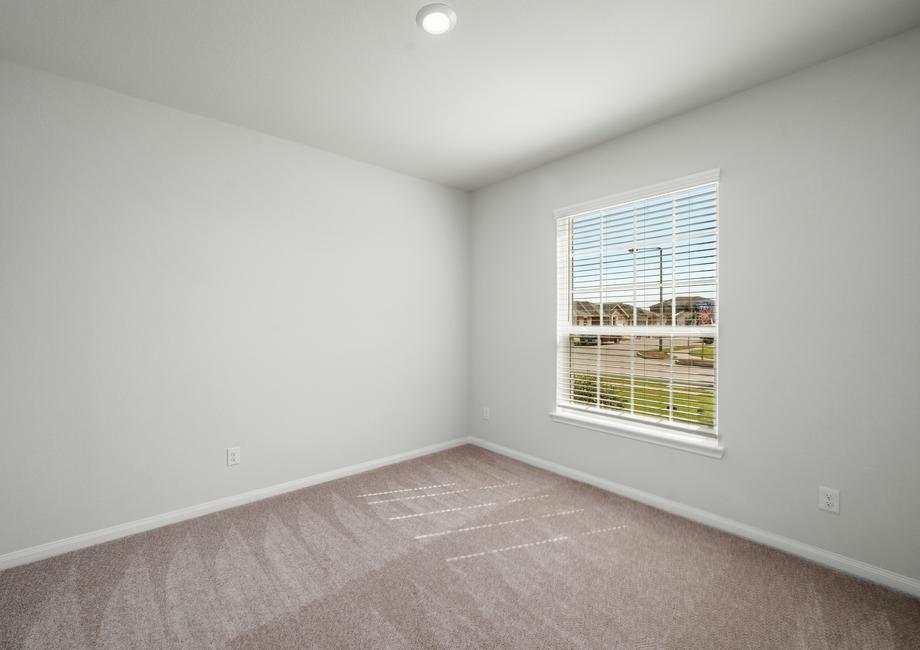 Secondary bedroom with a lot of natural lighting