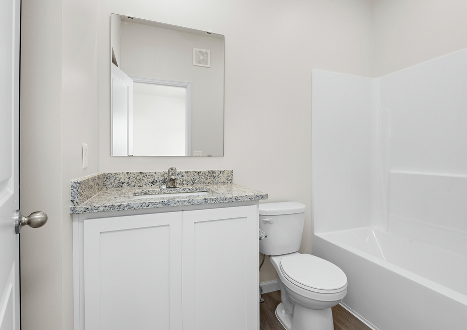 The secondary bathroom has a tub/shower combo.