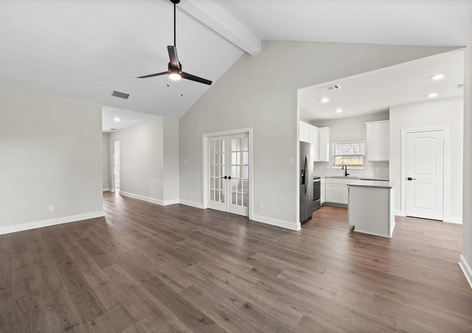 The family of the Sabine floor plan sits right off of the kitchen.