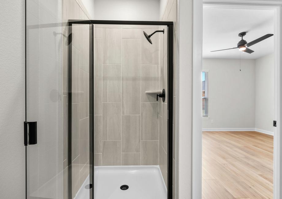 The master bath has a spacious, glass-enclosed shower
