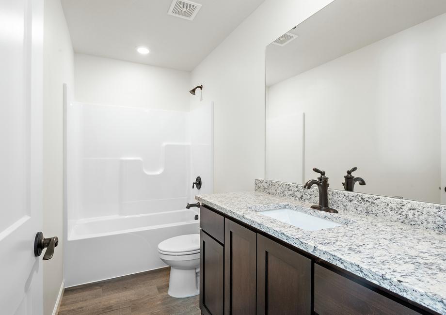 The guest bathroom has a large vanity ready for your guests
