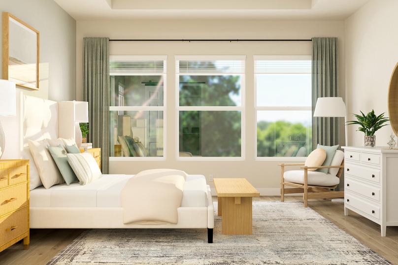 Rendering of the master suite in the
  Laurel floor plan highlighting the wall of windows for natural light. The
  room has wood-look flooring and is furnished with a bed, nightstand, dresser
  and armchair.