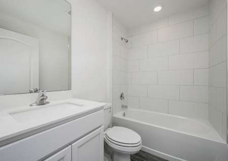 The guest bathroom has a large vanity and is ready for your guests