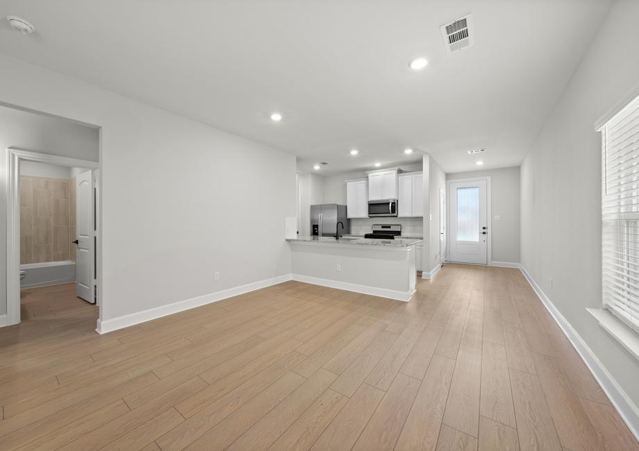 The Cedar has beauiful wood-style flooring throughout the home.