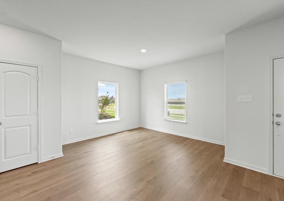 The dining room sits right off of the kitchen and has a large window.