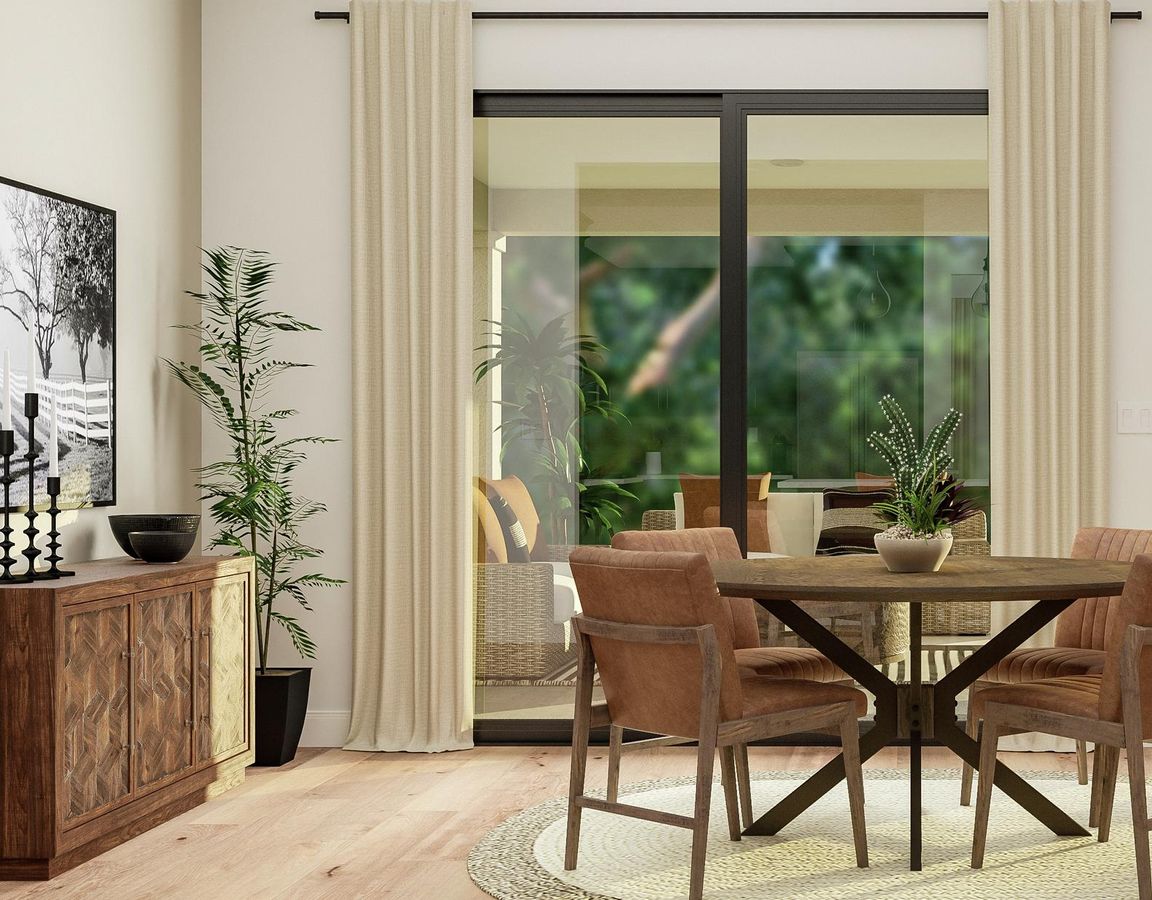 Rendering of the breakfast nook featuring
  a round dining table and four chairs next to sliding glass doors. On the wall
  is a sideboard below a large landscape photograph next to a potted plant.