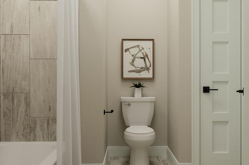 Rendering of a bathroom showing a tub
  with curtain, white toilet, and linen closet with tile flooring throughout.