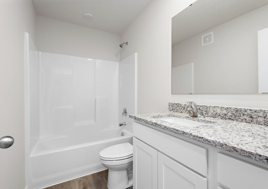 The secondary bathroom has a tub/shower combo.