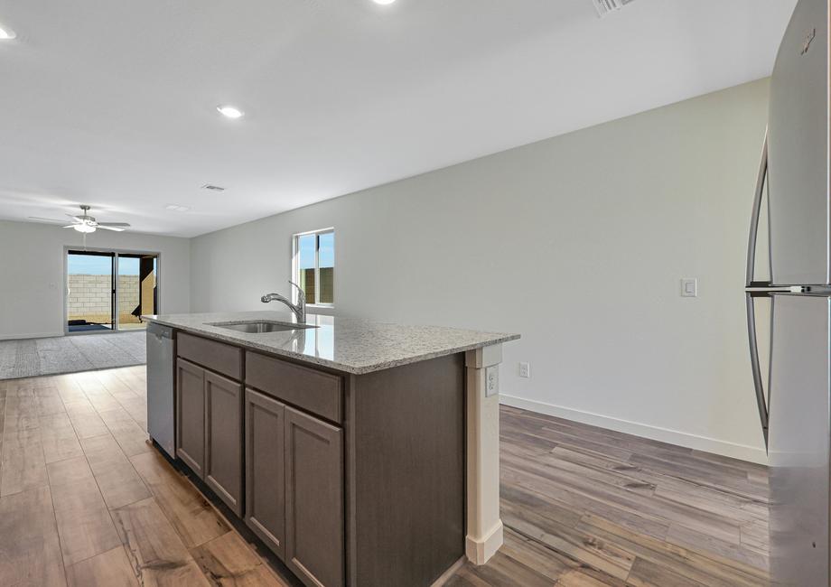 This kitchen has a beautiful granite island.