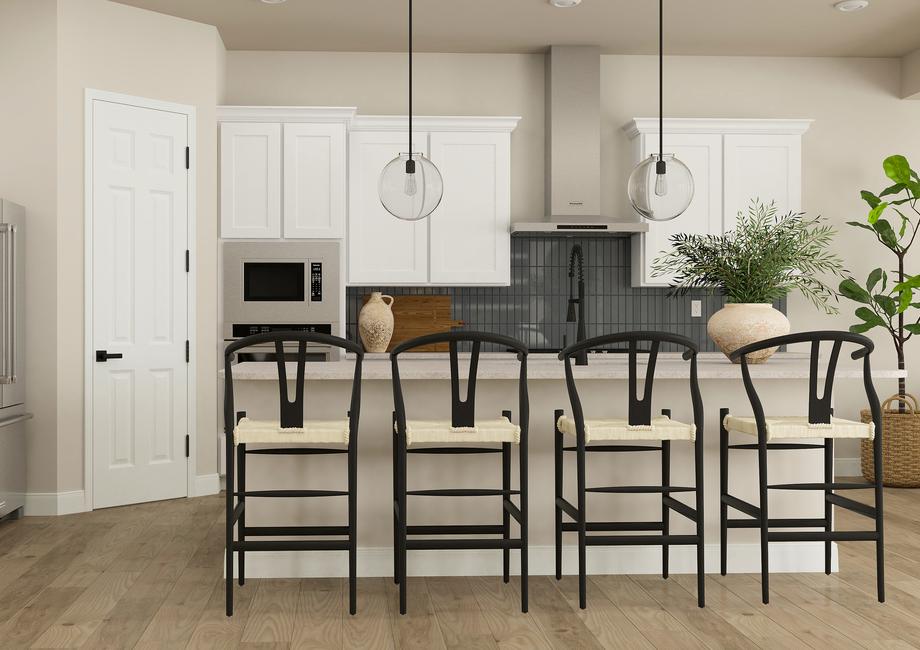 Rendering of the spacious kitchen in the
  Orchid, complete with a large island, tiled backsplash, white cabinets and
  stainless steel appliances.
