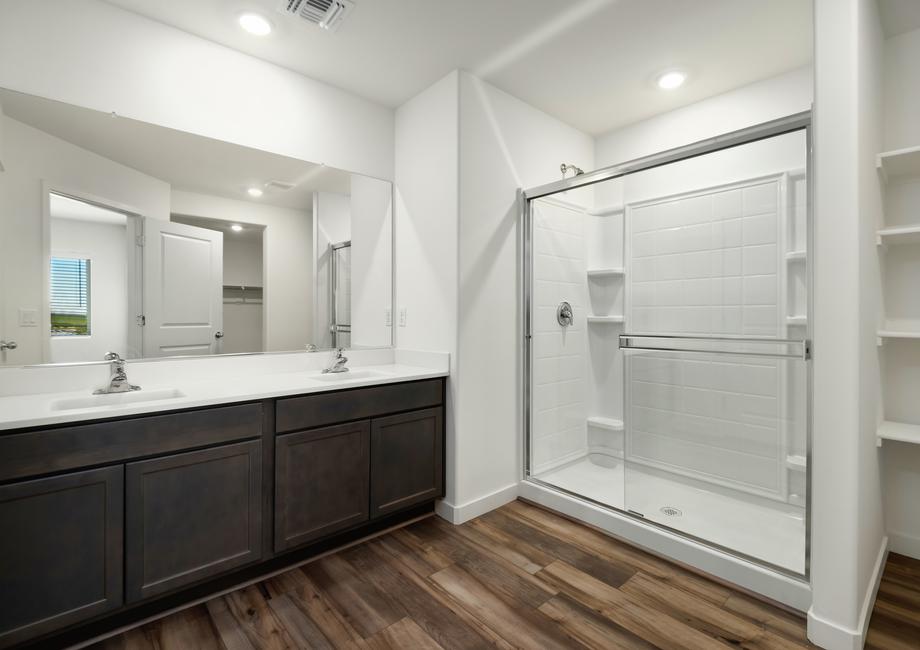 This bathroom has a glass-enclosed shower.