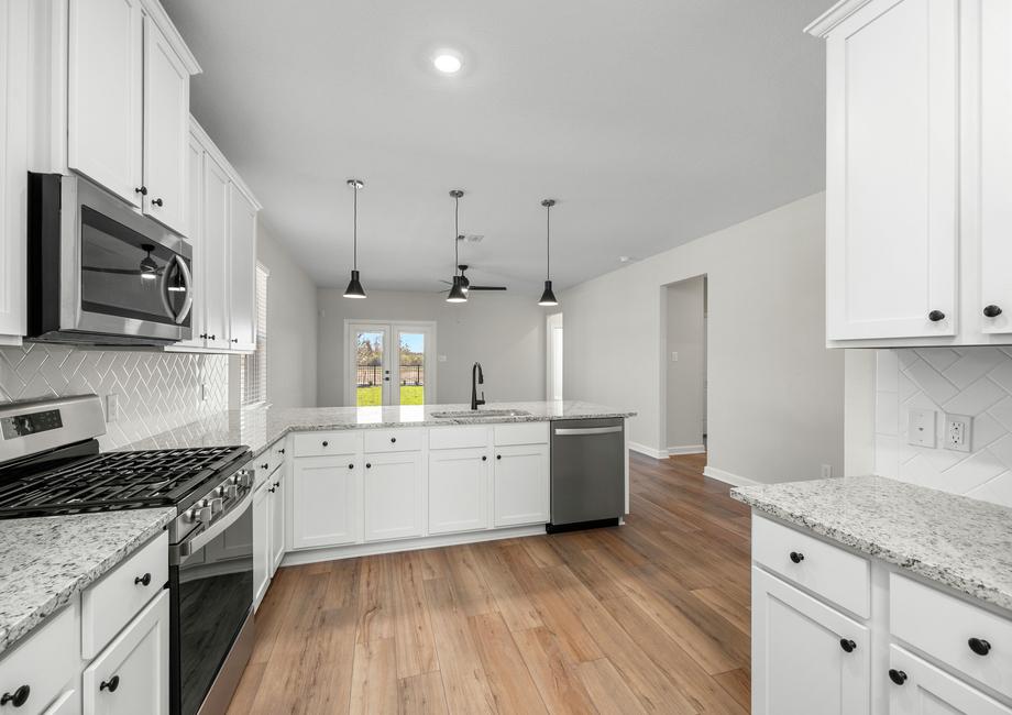 Stainless steel appliances are included in the kitchen.