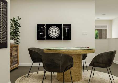 Rendering of game room with a
  round four-person table and a rug.