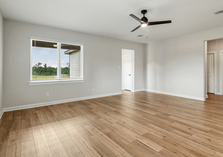 A large family room with a view of the backyard