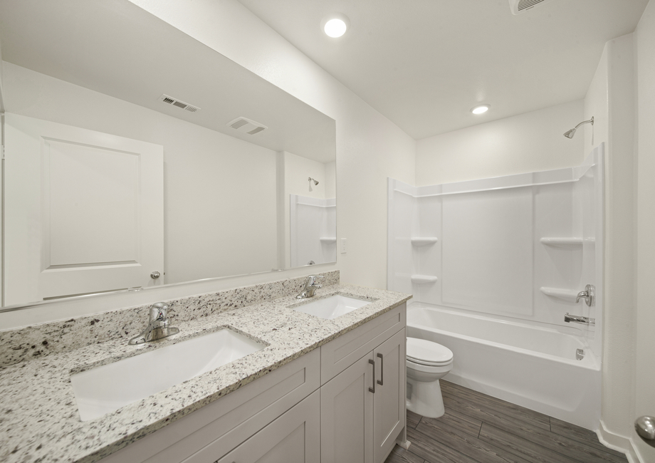 The secondary bathroom has a tub/shower combo.