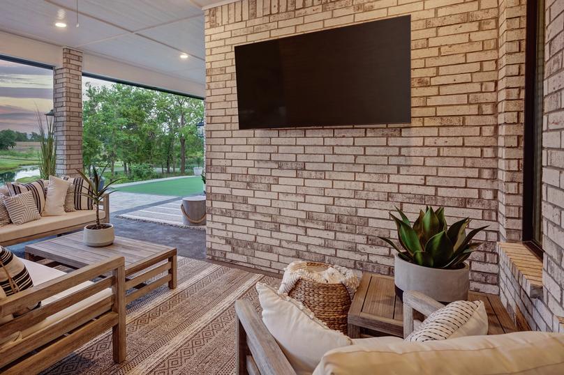 The covered outdoor living area is the perfect space to unwind.