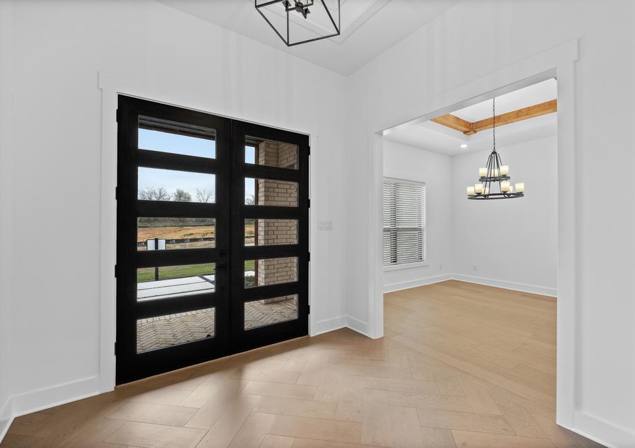 The beautiful foyer welcomes guests into this gorgeous home.