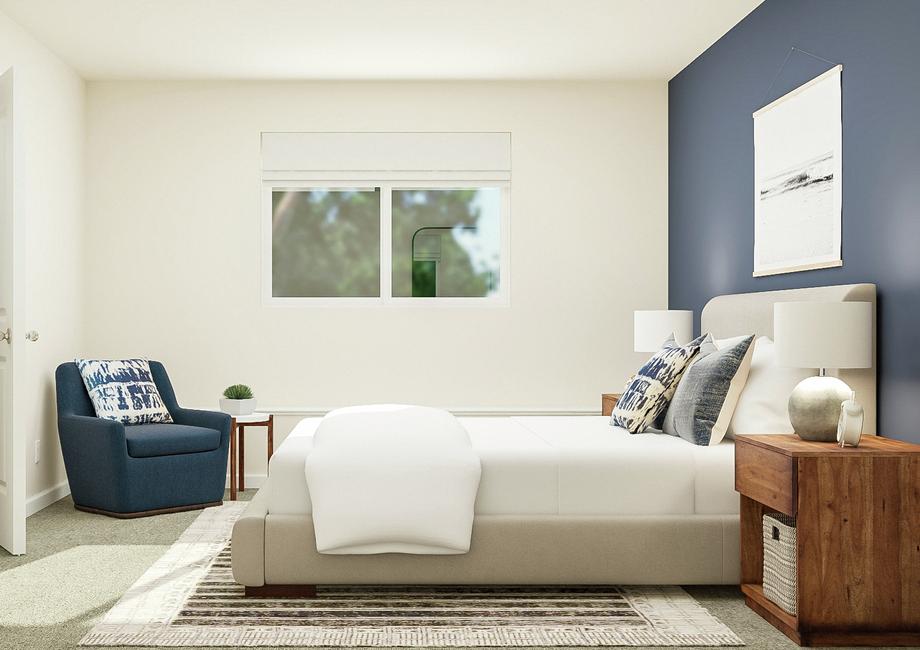 Rendering of a bedroom with a bed
  centered between two wood nightstands. A dark blue armchair and side table
  are in the corner under a window.