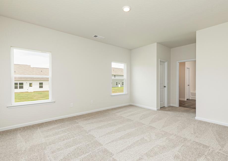 The Burton's spacious master bedroom offers plenty of bright, natural light