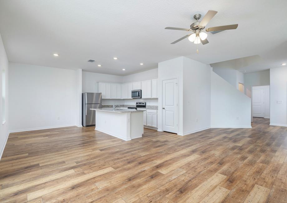 The Dade has a large entertainment space that includes the dining, living room, and kitchen