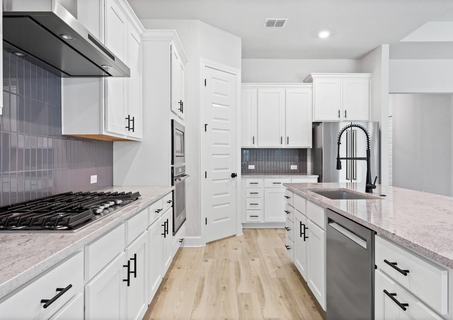 The fully loaded kitchen is a dream with stainless steel appliances.