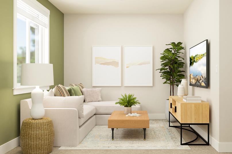 Rendering of the upstairs flex room
  furnished with a white sectional couch and a tv console.