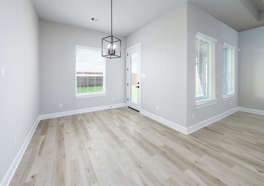 Off the kitchen you will find the dining area that overlooks the back yard.