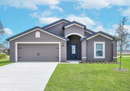 The Estero by LGI homes is a beautiful home with a two car garage