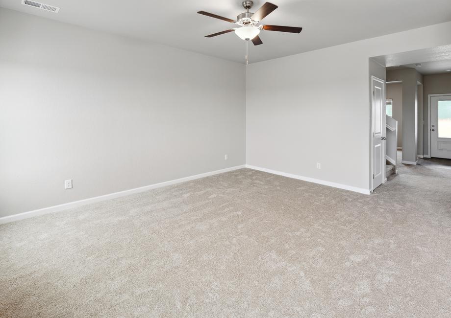 Spacious living room with a ceiling fan for game nights and watching your favorite shows.