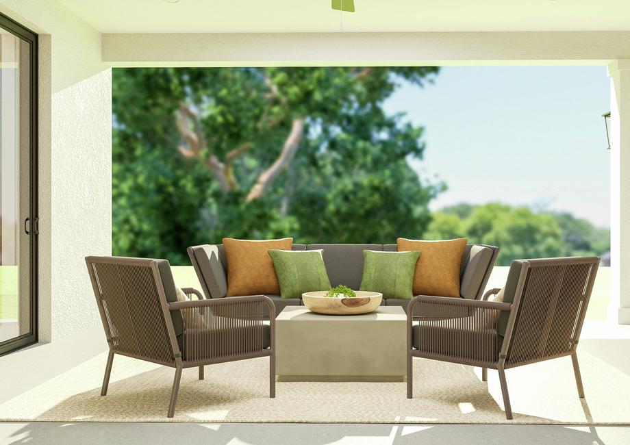 Rendering of the covered patio featuring
  an outdoor sofa, two armchairs, coffee table and rug looking out to the
  backyard.