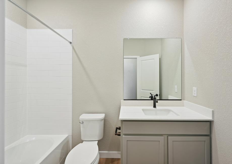 The secondary bathroom of the Arapaho has a shower-tub combo.