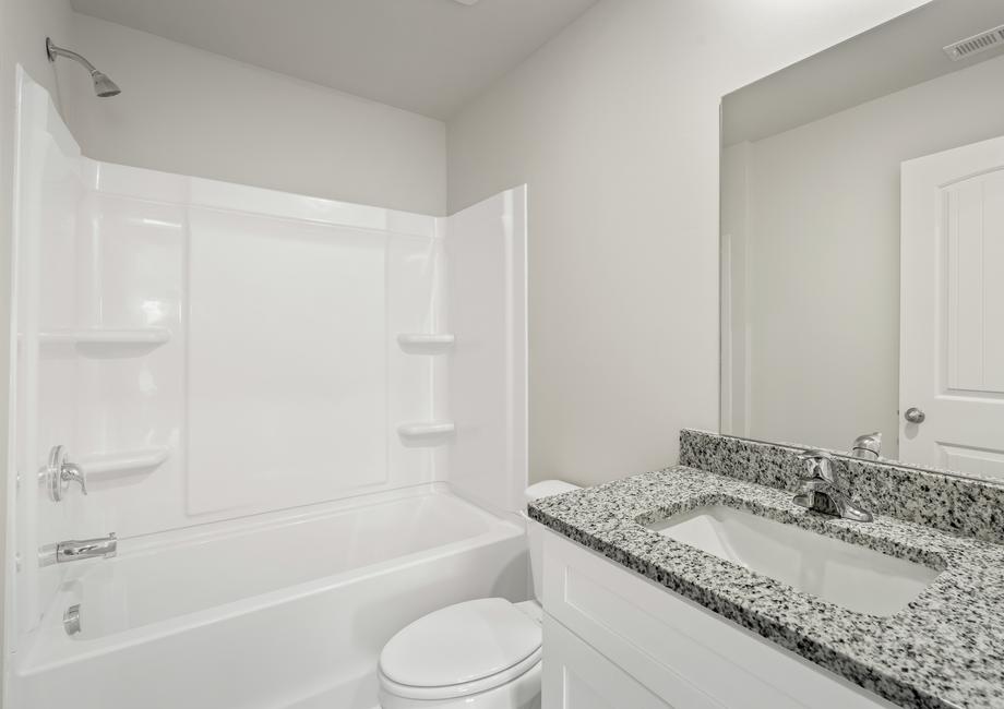 The secondary bathroom offers plenty of space for your guests to get ready