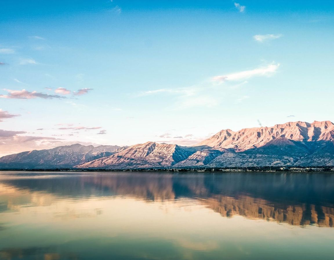 Mountains surrounded by a lake.