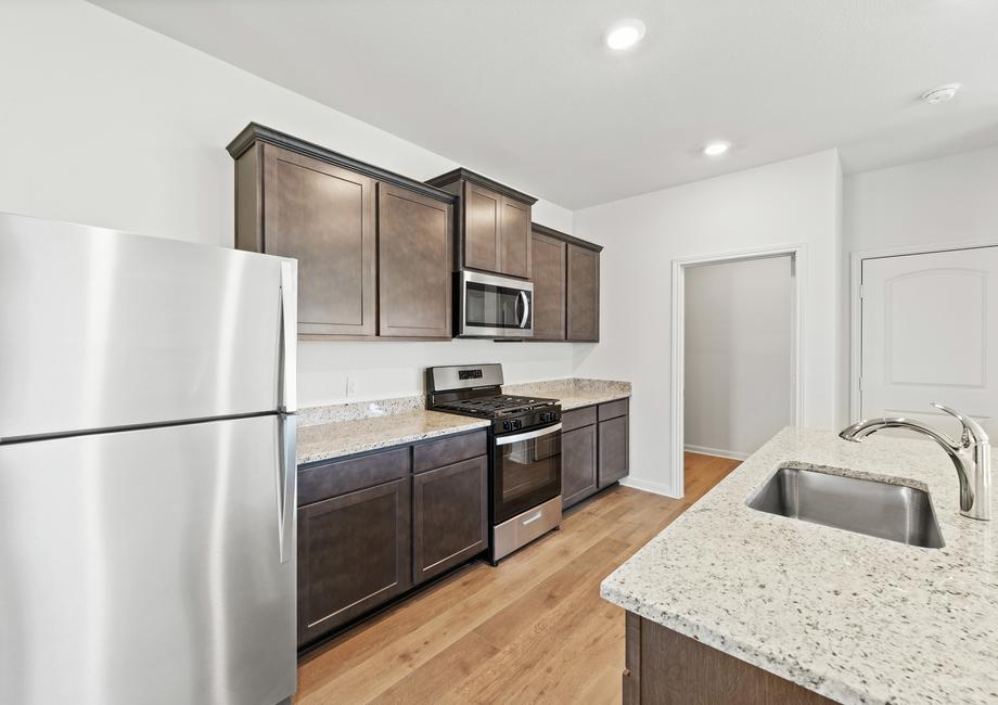 The kitchen of the Camelia has a gorgeous wood cabinetry.