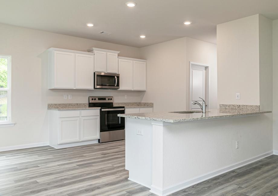 The kitchen is chef-ready and comes equipped with stainless steel appliances