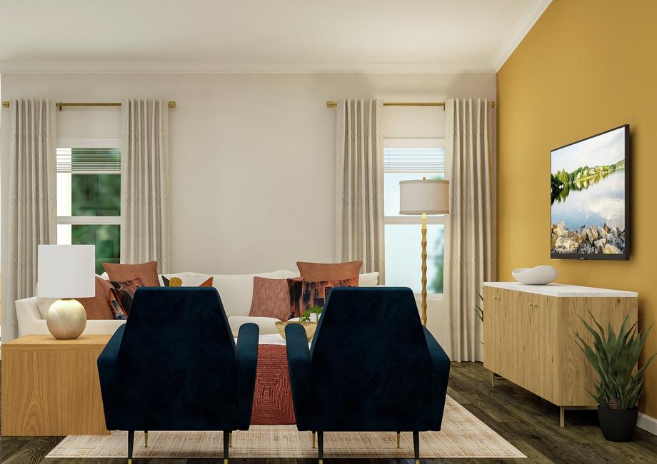 Rendering of the living room looking  towards the back of the house. The space has vinyl plank wood flooring and  two windows and is furnished with a sectional and two armchairs.