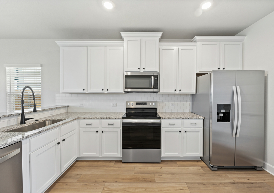 Stainless steel appliances are included.