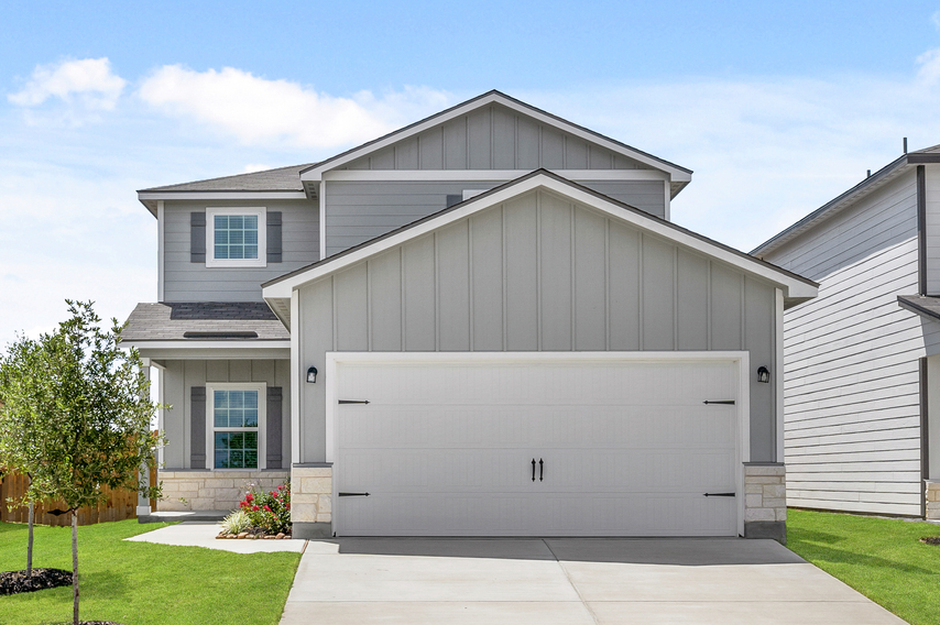 Exterior of the two-story Marek with grey siding and shutters on every window