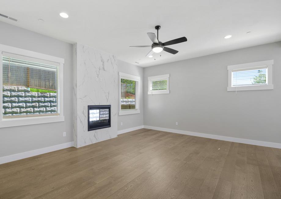 The highlight of the living room is the dual-sided fireplace that connects to the covered outdoor living area.