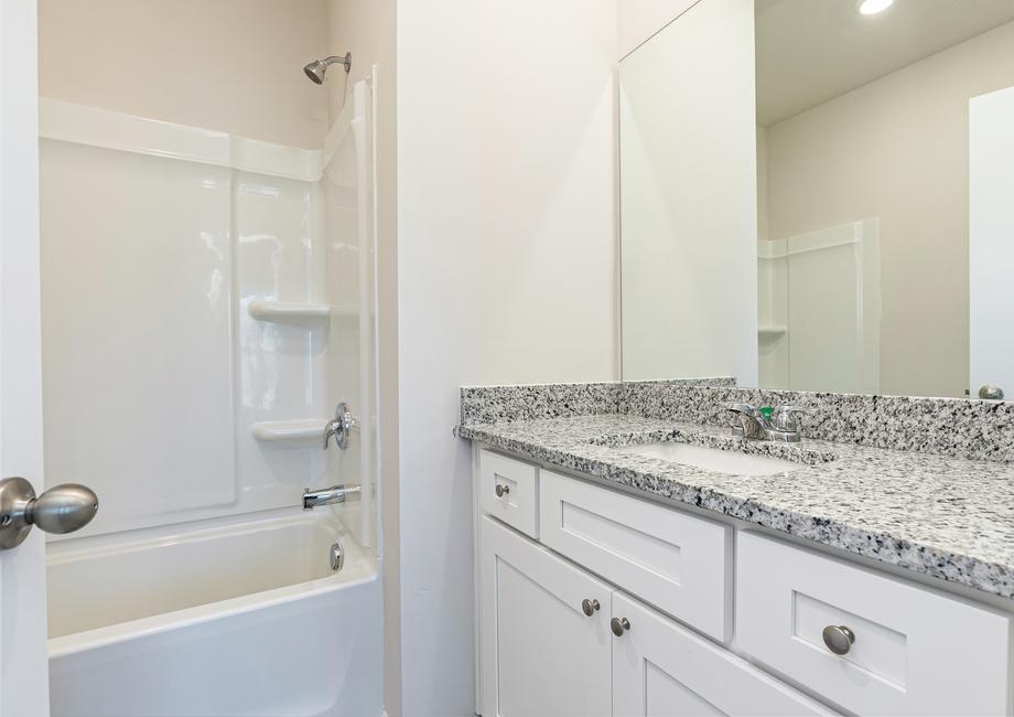 Get ready for your day in this gorgeous master bathroom