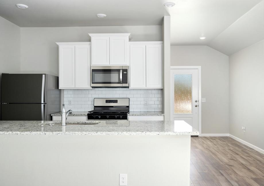 The kitchen of the Klein has beautiful white wood cabinets.