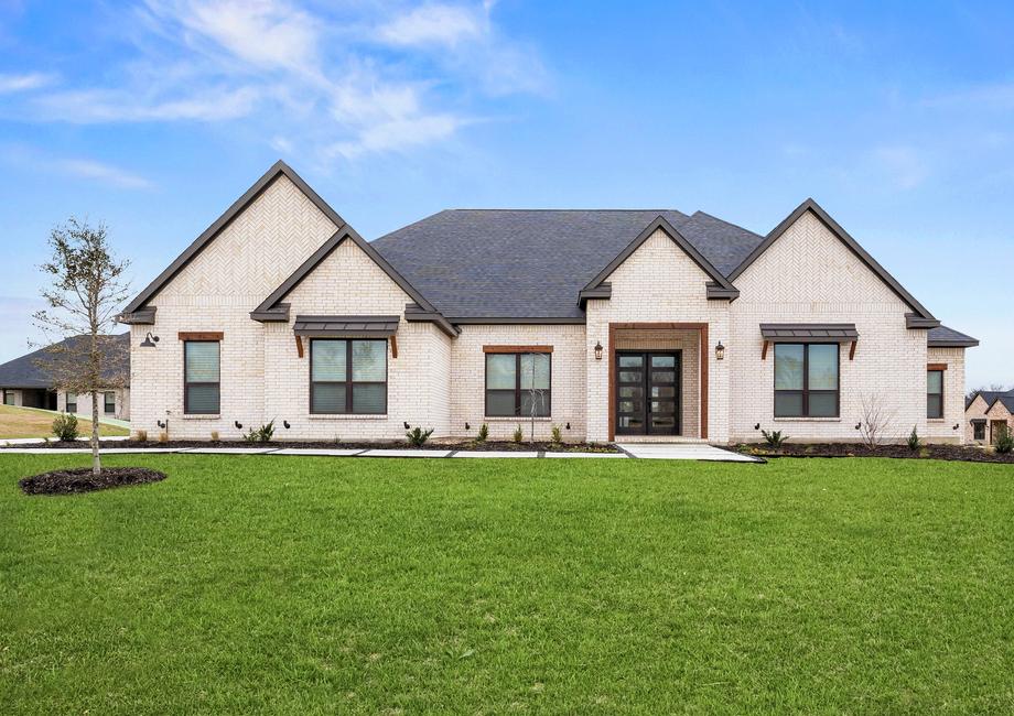 The Mantle II is a beautiful, one-story brick home with wood accents.