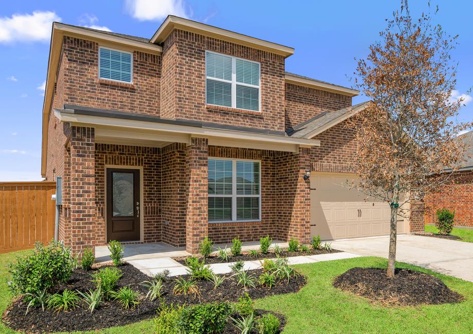 Beautiful two story home with brick and front yard landscaping