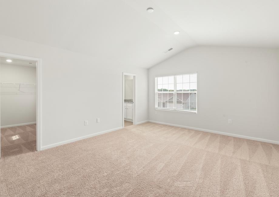 Master bedroom with carpet.