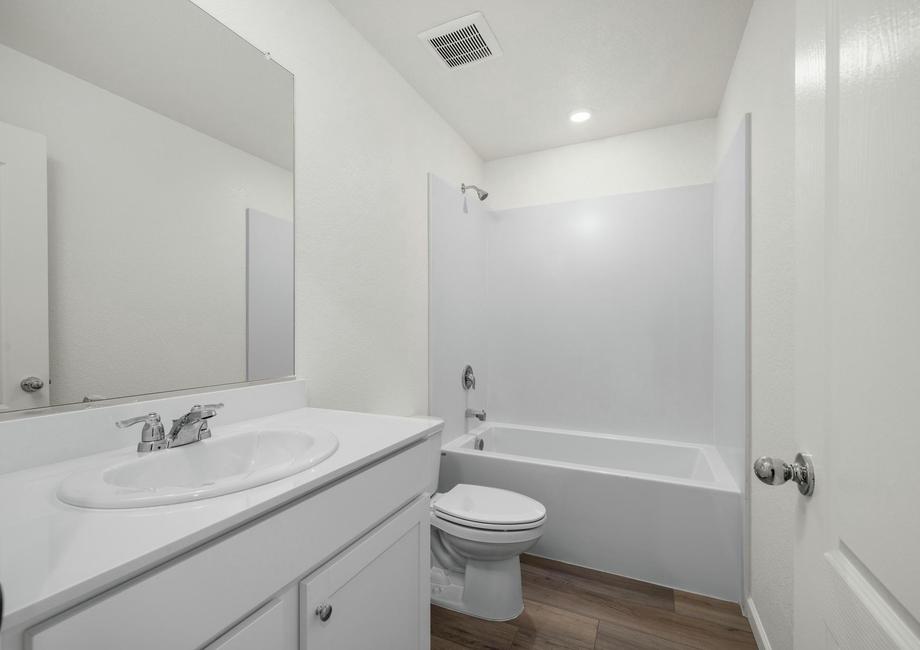 The secondary bathroom has a tub/shower combo.