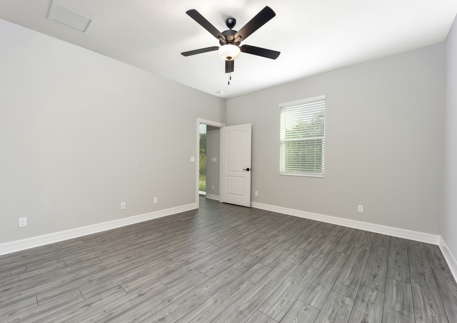 The master bedroom is spacious with a large window