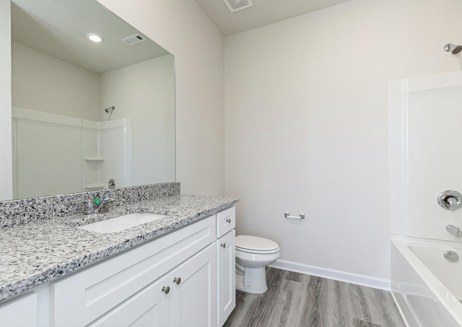 The master bathroom offers plenty of space to get ready in the mornings